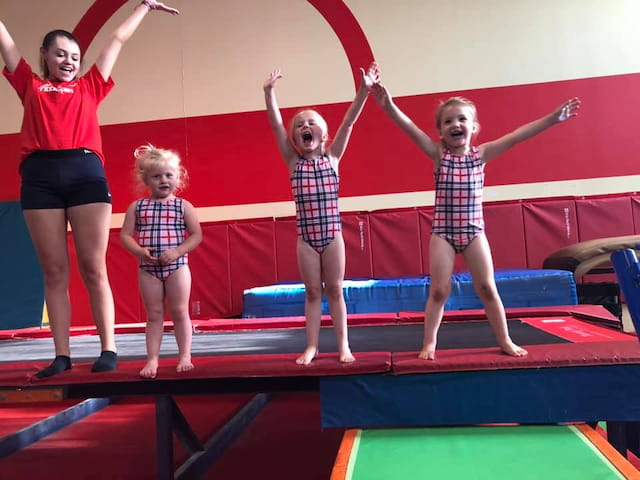 a group of children on a mat