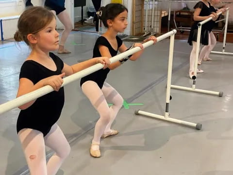 a couple of women practicing martial arts