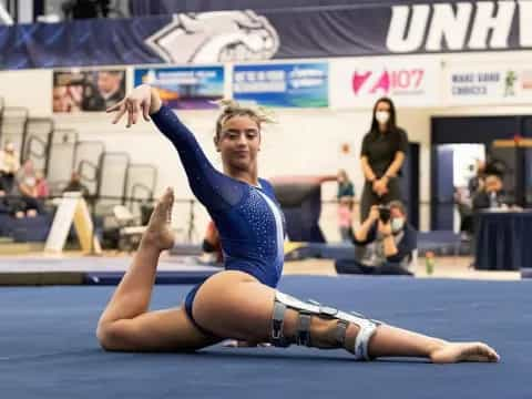 a woman doing a gymnastics move