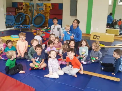 a group of children sitting on the floor