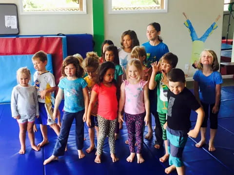 a group of children standing in a room