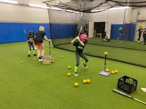 a group of kids play a game of tennis