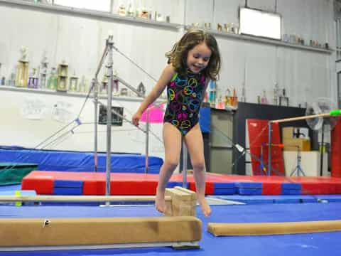 a girl standing on a bar