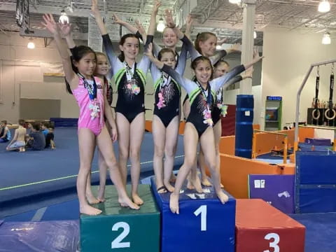 a group of people posing on podiums