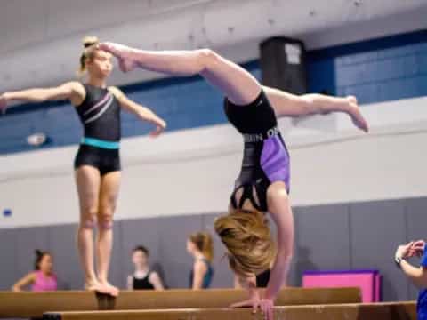 a couple of women performing gymnastics