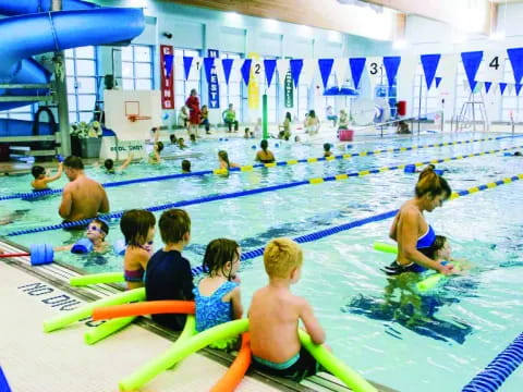 a group of people in a swimming pool