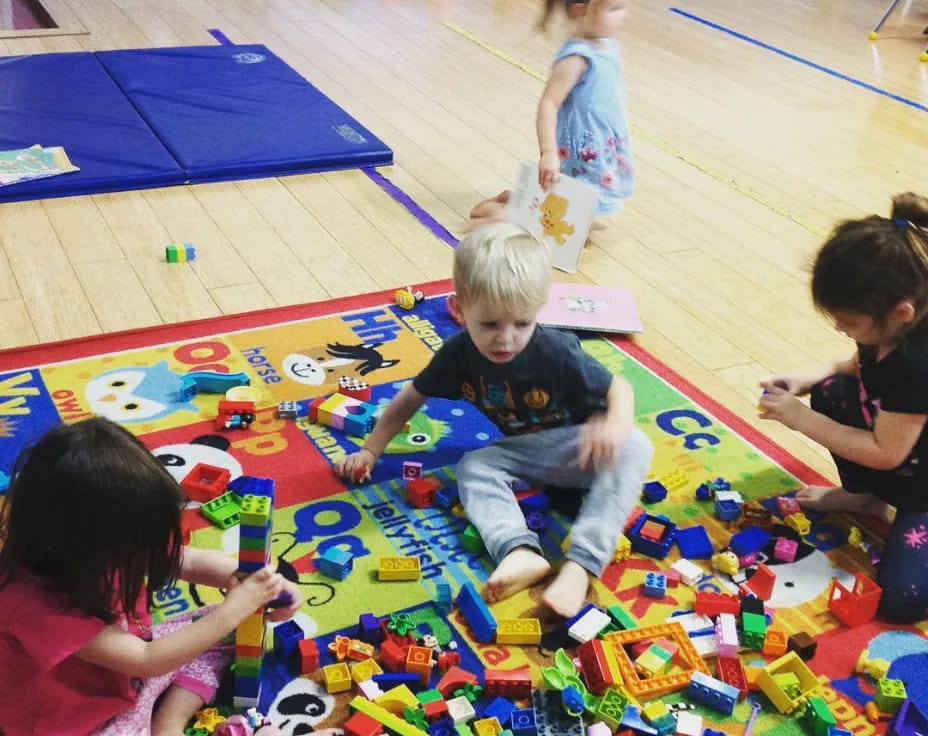 children playing on a colorful mat