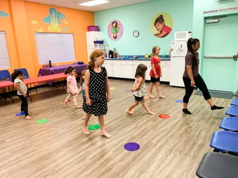 a group of children playing in a room