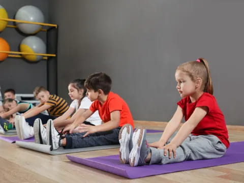 a group of children sitting on the floor