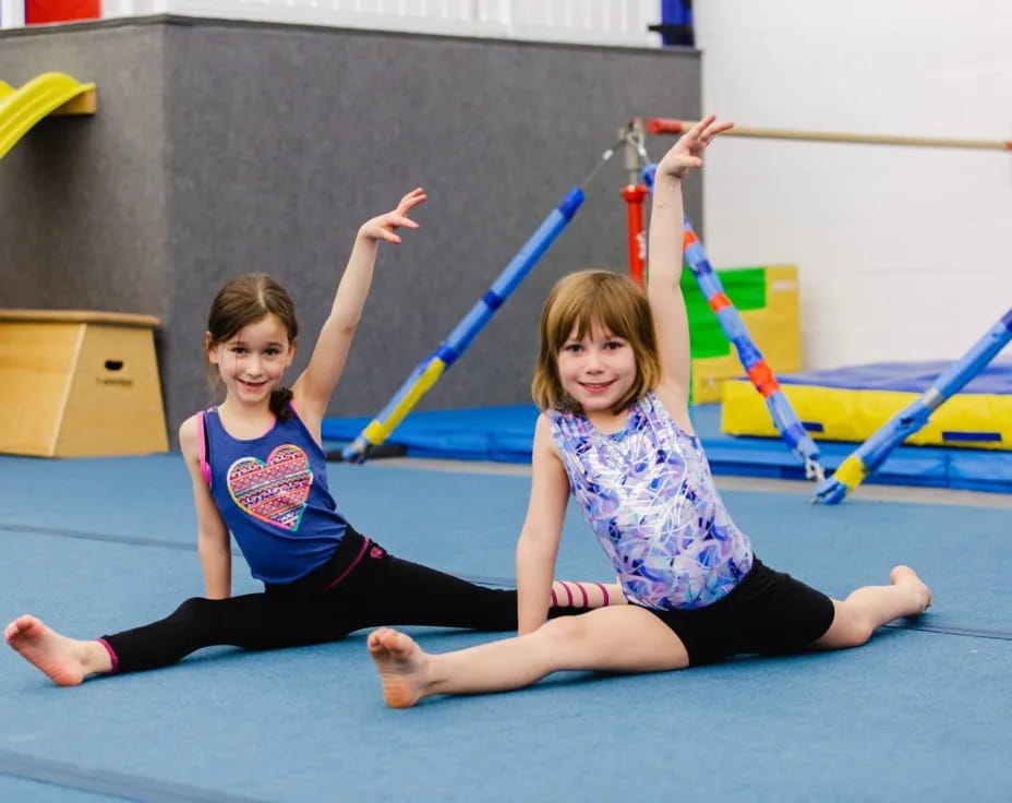 two girls on a mat