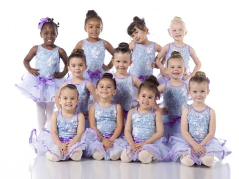 a group of girls in dresses