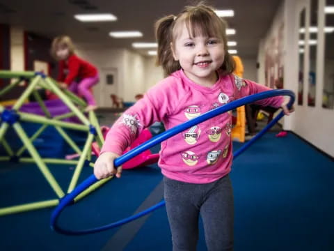 a girl holding a toy sword