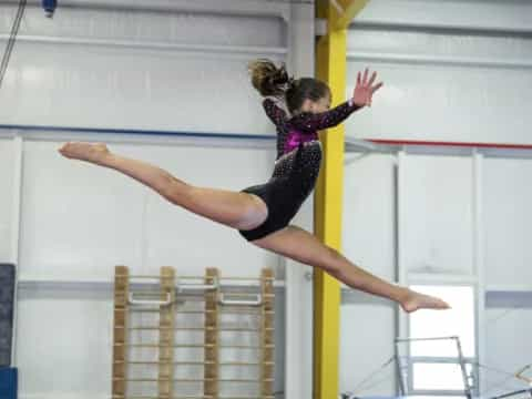 a woman doing gymnastics