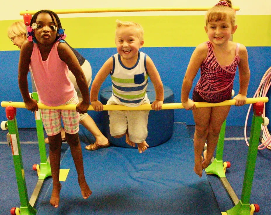 a group of children playing on a trampoline