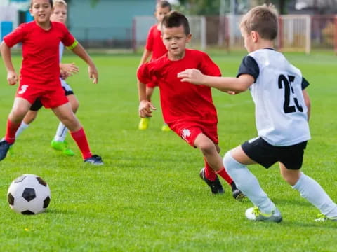 a group of boys playing football