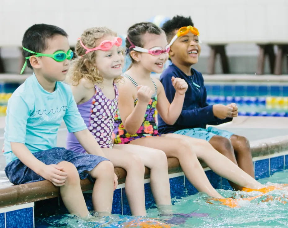 a group of kids in a pool