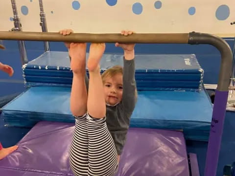 a girl lying on a trampoline