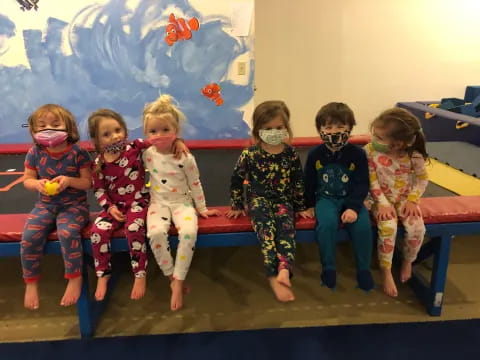 a group of children wearing masks