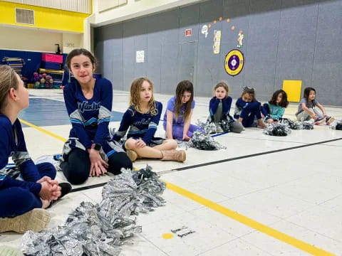 a group of people sitting on the floor