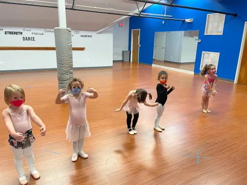 a group of children dancing