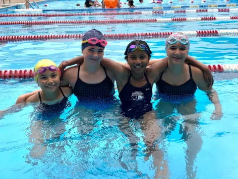 a group of women in a pool