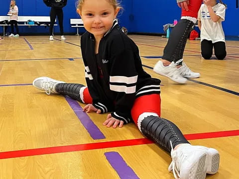 a boy kneeling on the floor