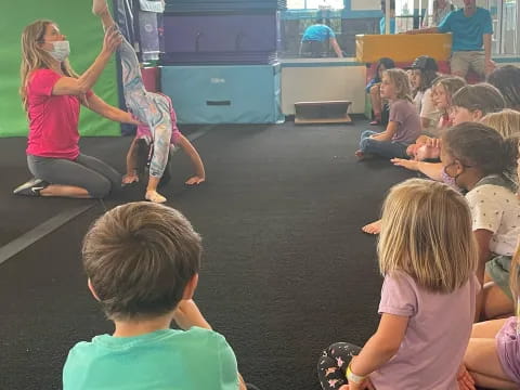 a group of children sitting in a circle