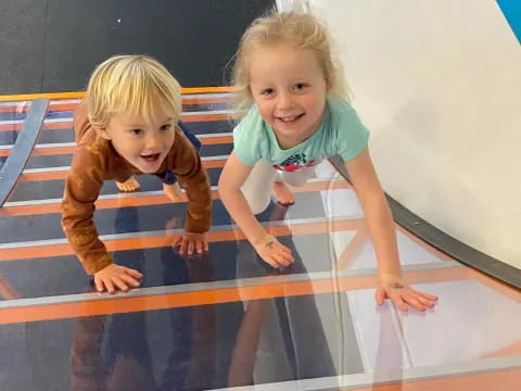 two children on a mat