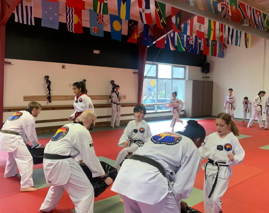 a group of people in karate uniforms