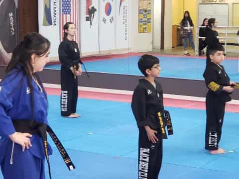 a group of people in a karate class