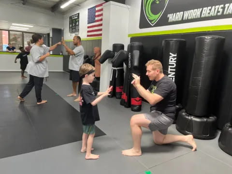 a person and a child working out in a gym