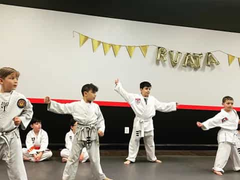 a group of people in karate uniforms