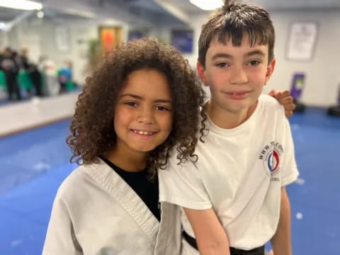 a boy and girl posing for a picture