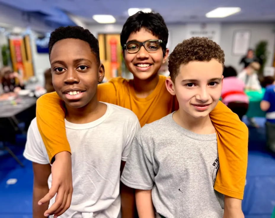 a group of boys posing for a picture