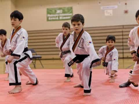 a group of boys in karate uniforms