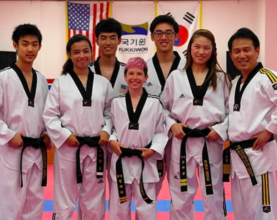 a group of people in karate uniforms