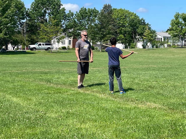 a couple of men playing baseball