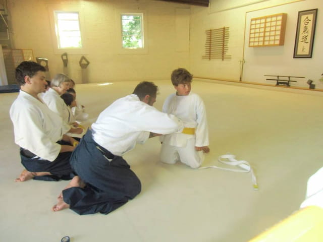 a group of people in white uniforms