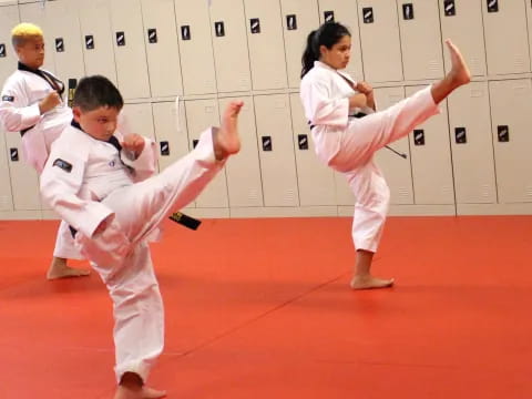 a group of people in karate uniforms