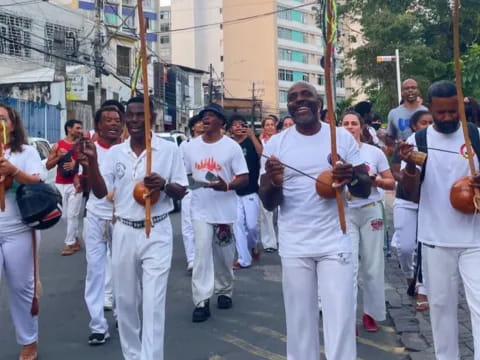 a group of people in white marching