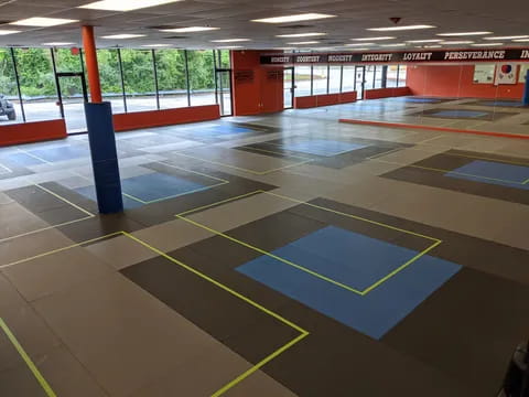 a gym with a few mats