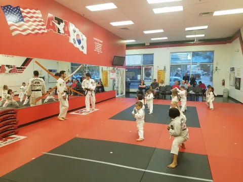 a group of children in karate uniforms