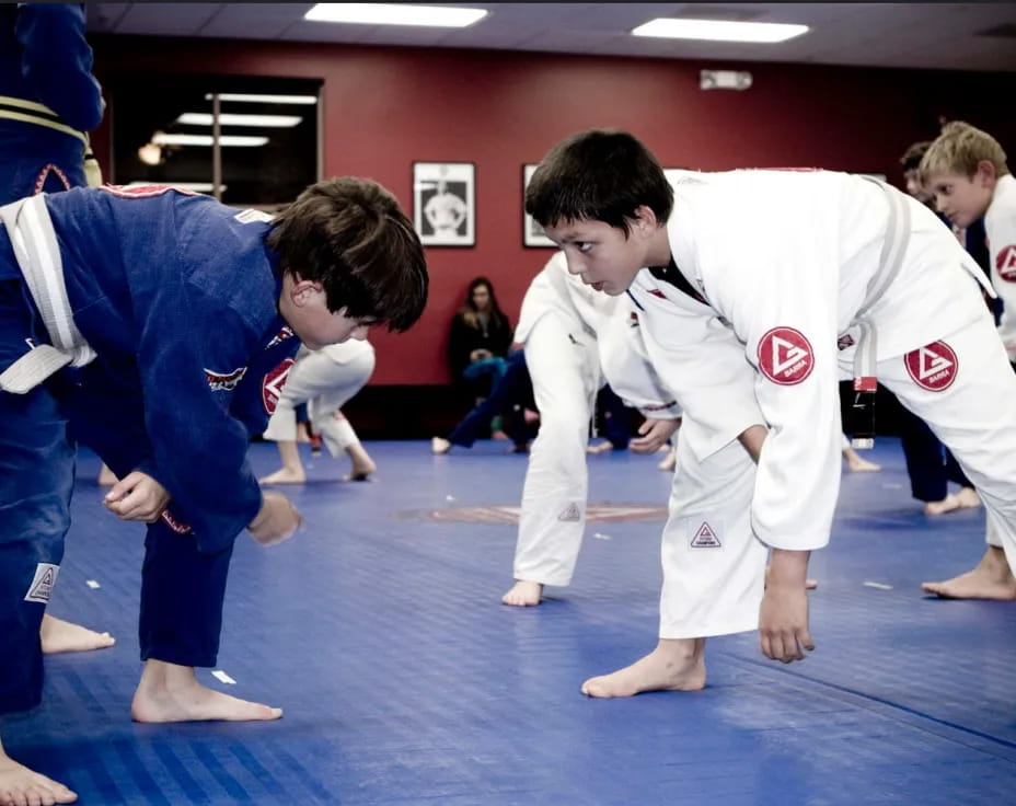 a group of people in karate uniforms