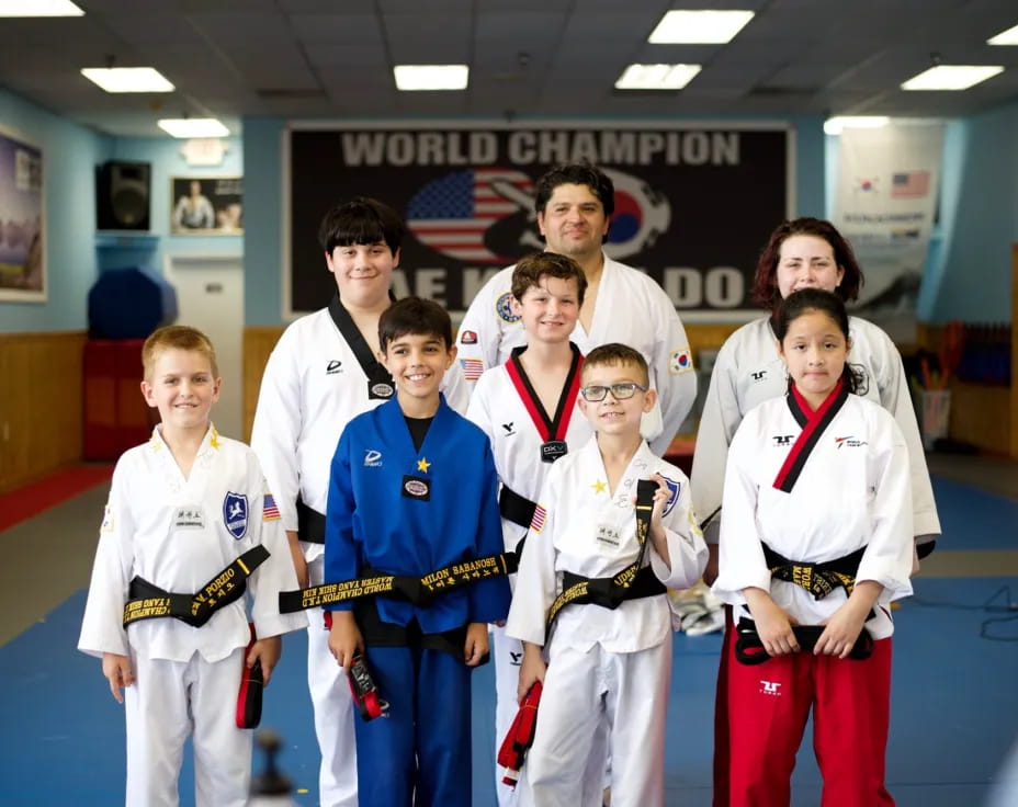 a group of people in karate uniforms