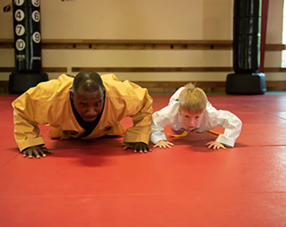 a person and a child lying on the floor