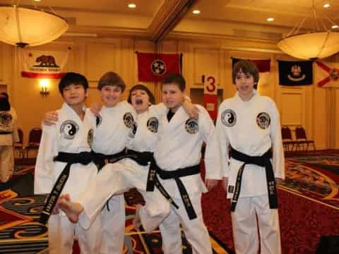 a group of people in karate uniforms