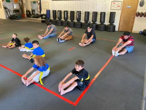 a group of people sitting on the floor