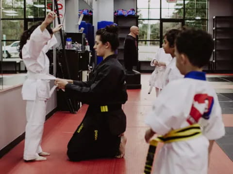 a group of people in karate uniforms