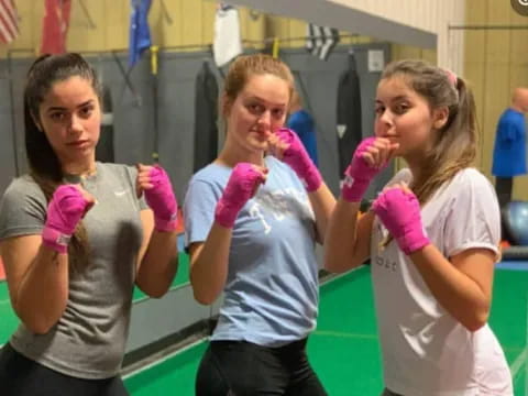 a group of girls wearing gloves