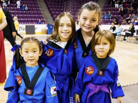 a group of girls in blue uniforms